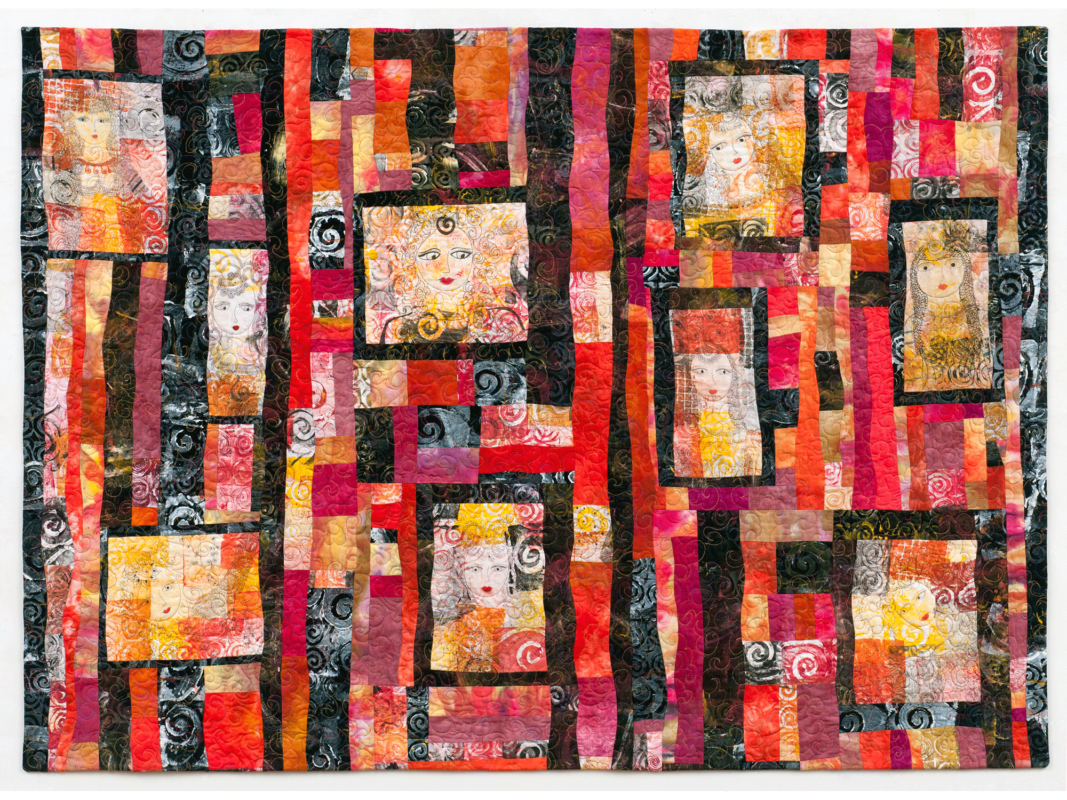 The artwork titled "Nine Faces of Women" was created in 2010 by Susan Schrott. The image is a large quilt with highly pigmented pink, red, purple, yellow, orange, and black swatches. There are nine semi-abstract faces of women sewn into the larger swatches on the quilt, framed by strips of black fabric. This textile piece is 42 inches tall and 58 inches wide.